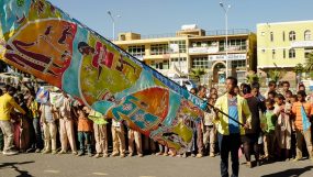 In Ethiopia, a large silk flag is held for the crowd to see