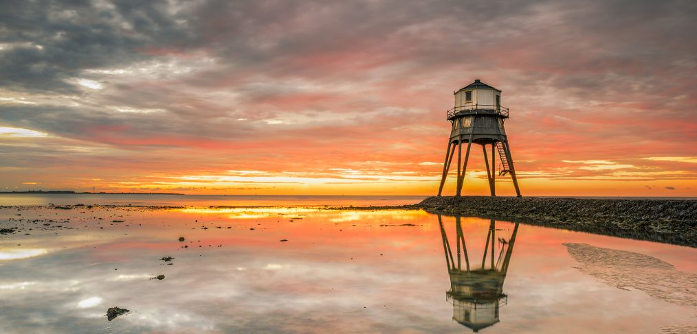 Sunrise behind the old lighthouse, in Dovercourt Bay