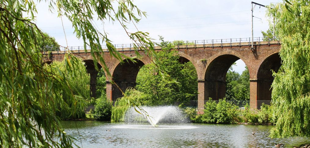 Chelmsford, England - A train viaduct spans across Central Park