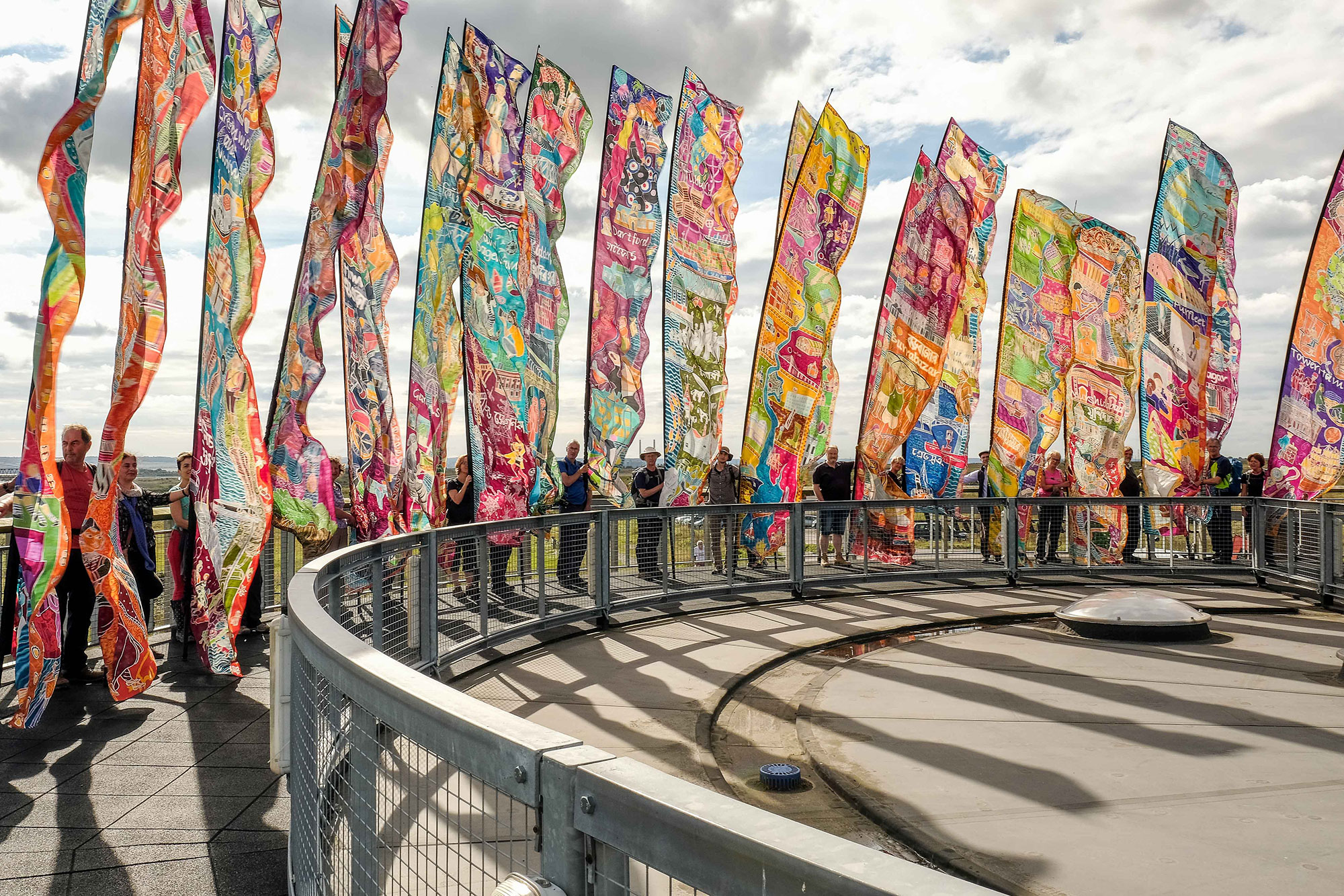 Silk River flags on top of the Thameside Nature Discovery Park Visitor Centre in Mucking